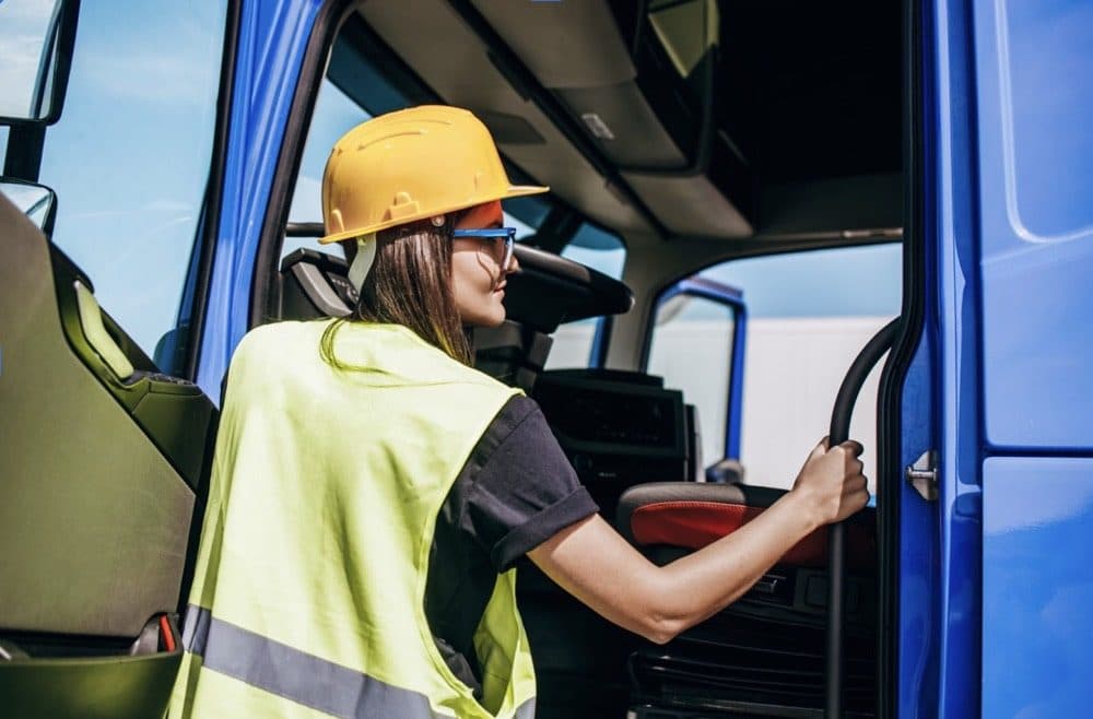 Apprentice truck driver in hi-vis